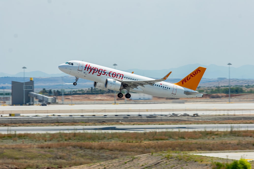 a large jetliner taking off from an airport runway