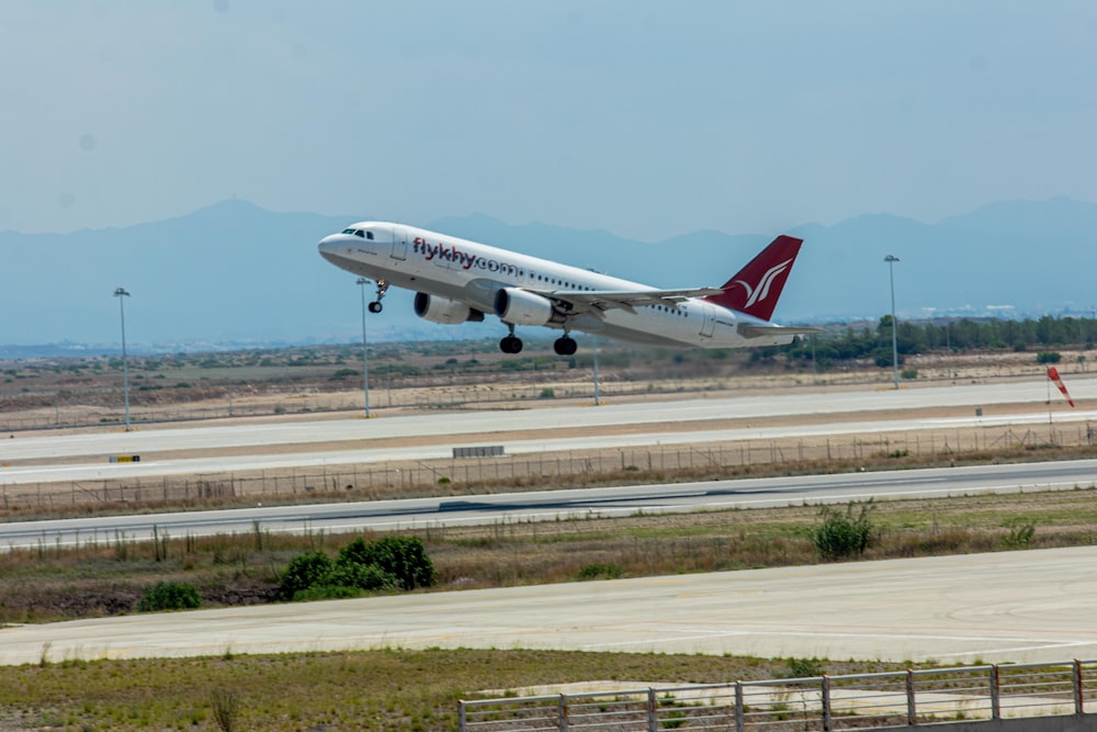 a large jetliner taking off from an airport runway