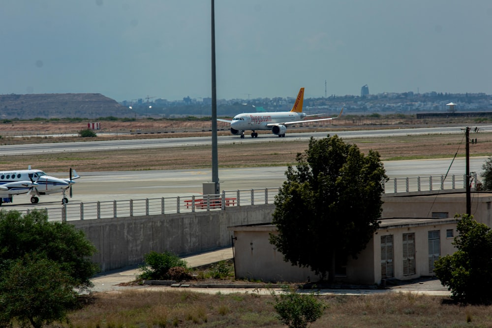 an airplane is on the runway of an airport