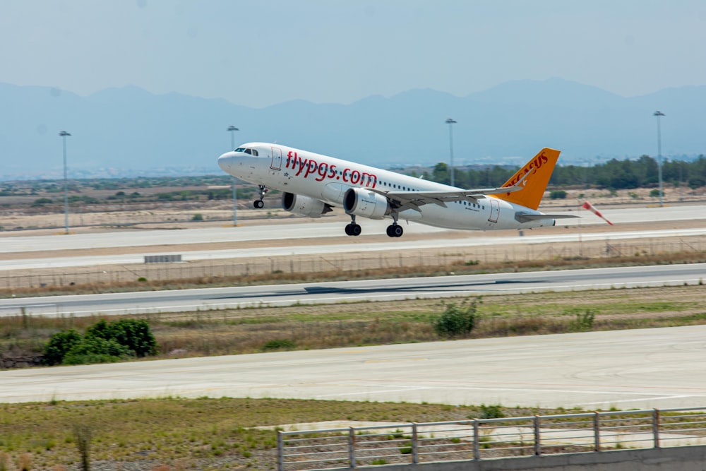 a large jetliner taking off from an airport runway