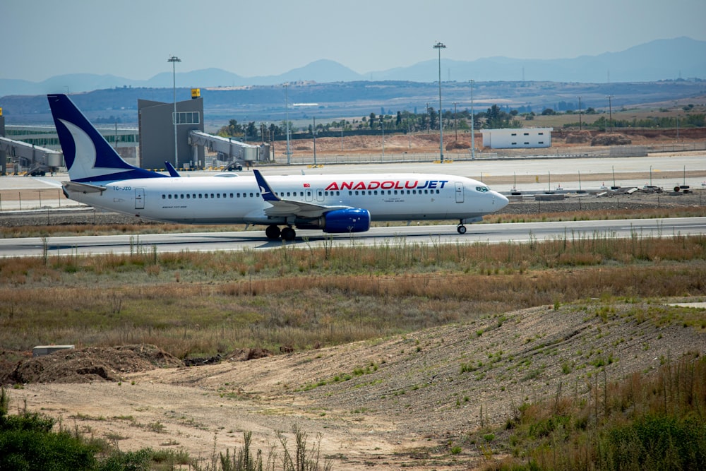 a large jetliner sitting on top of an airport runway