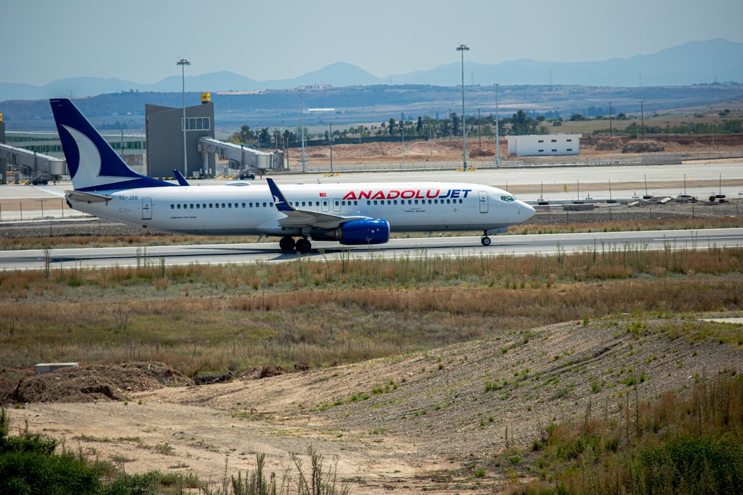 a large jetliner sitting on top of an airport runway,