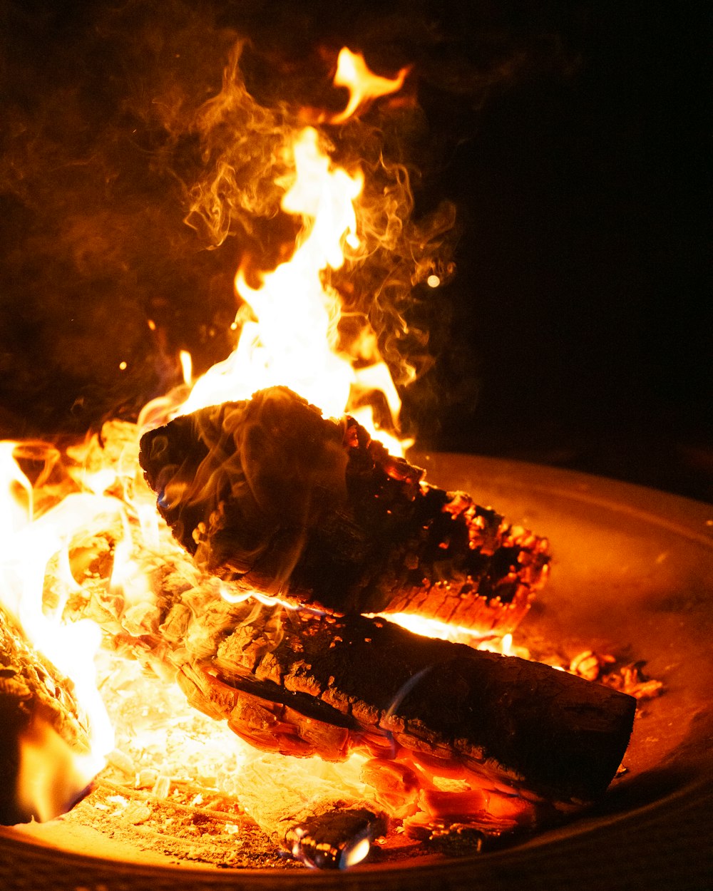 a close up of a fire burning in a fire pit