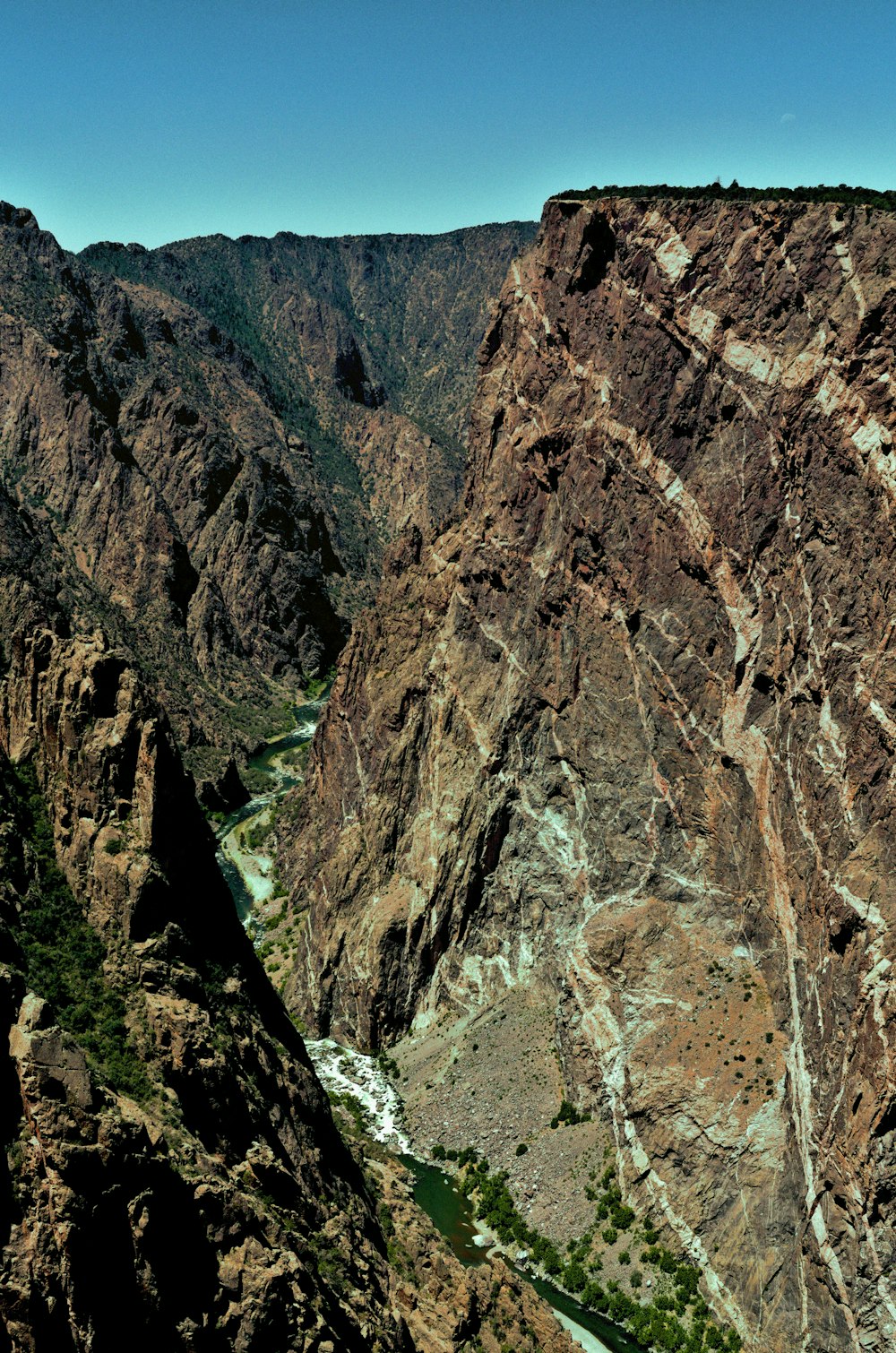 a view of a canyon with a river running through it