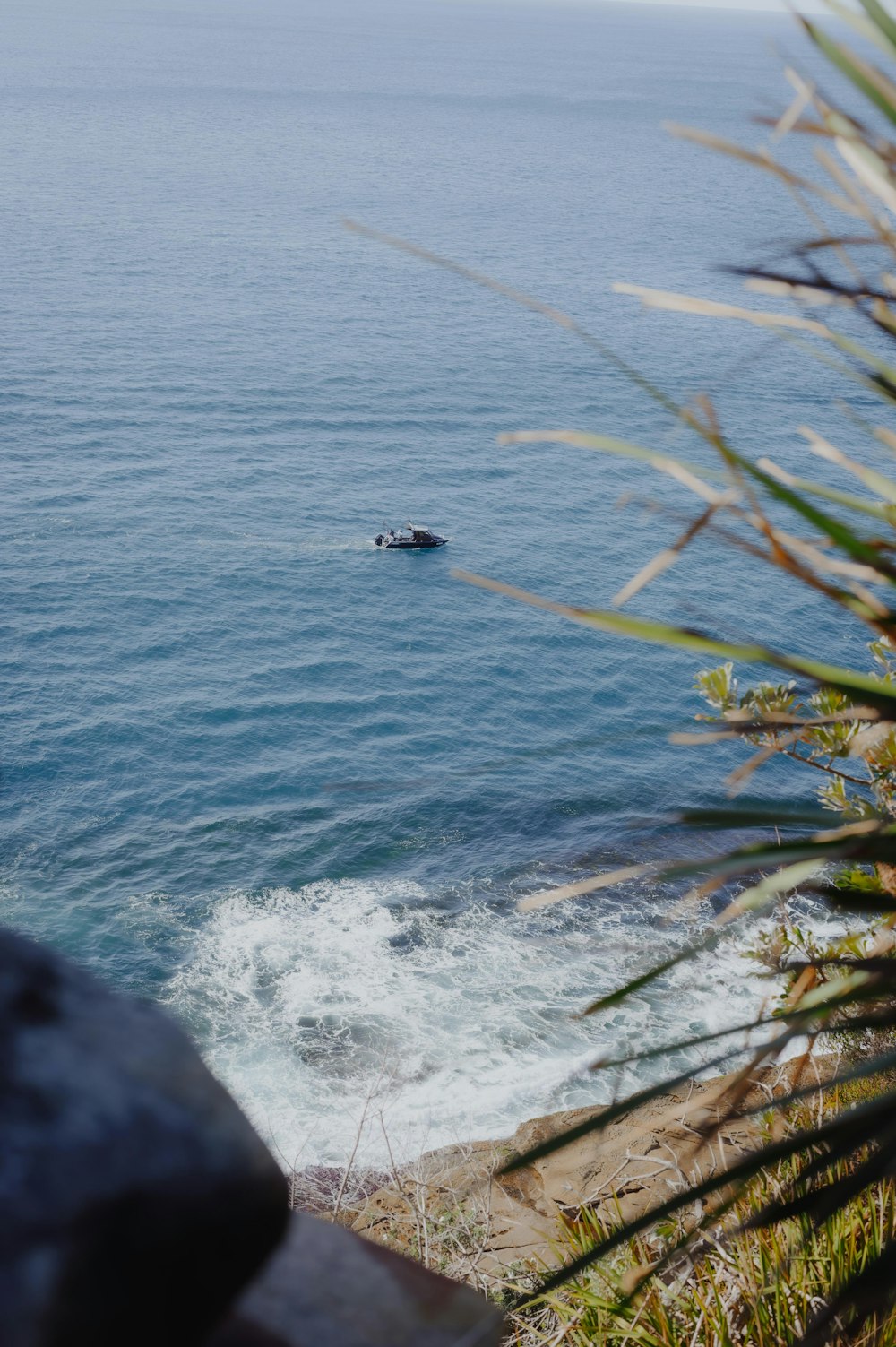 a boat is in the water near the shore