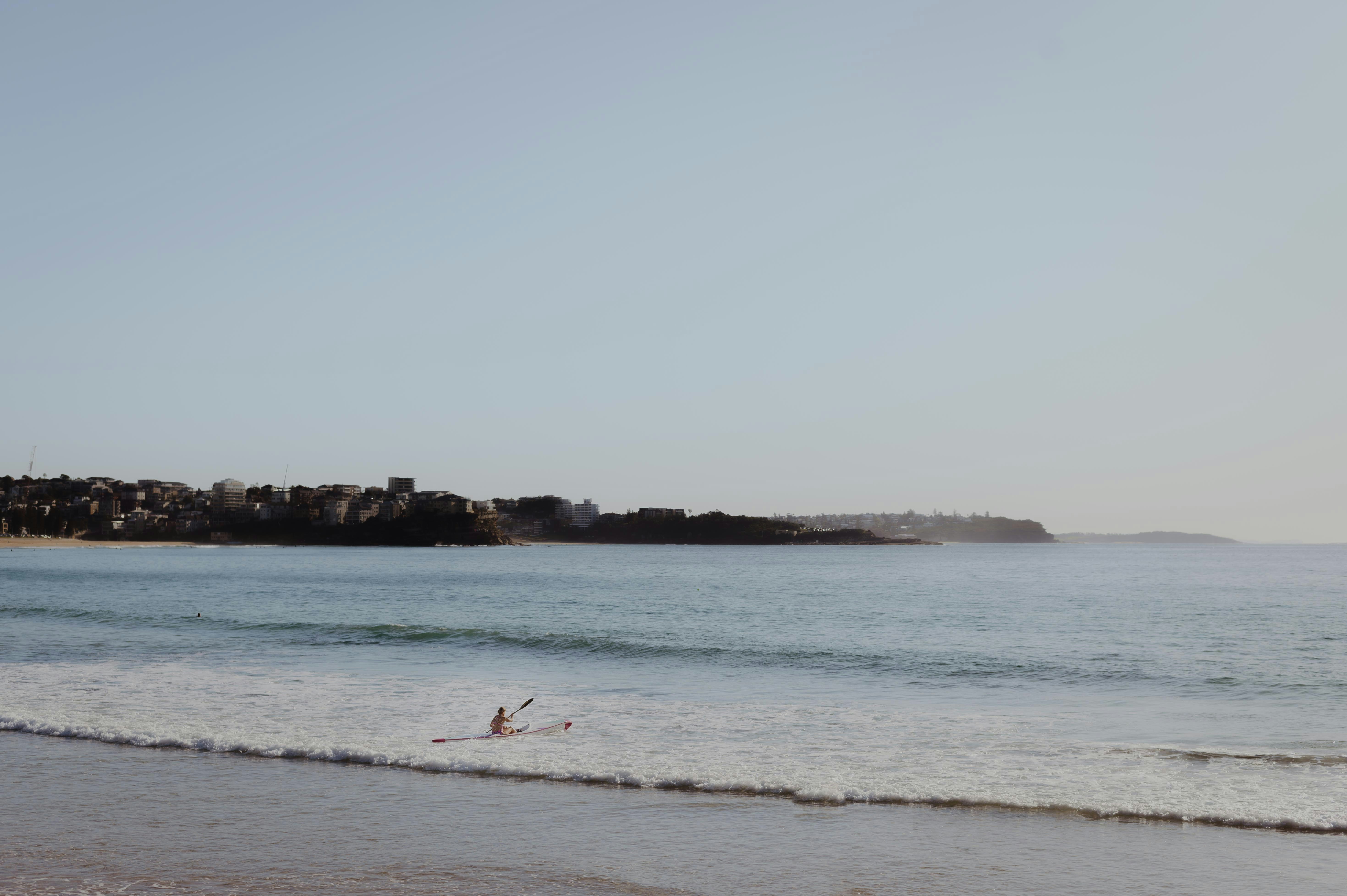 a person riding a surfboard on a wave in the ocean