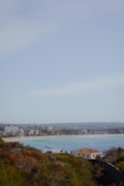 Wide-angle view of a beachfront property with clear skies.