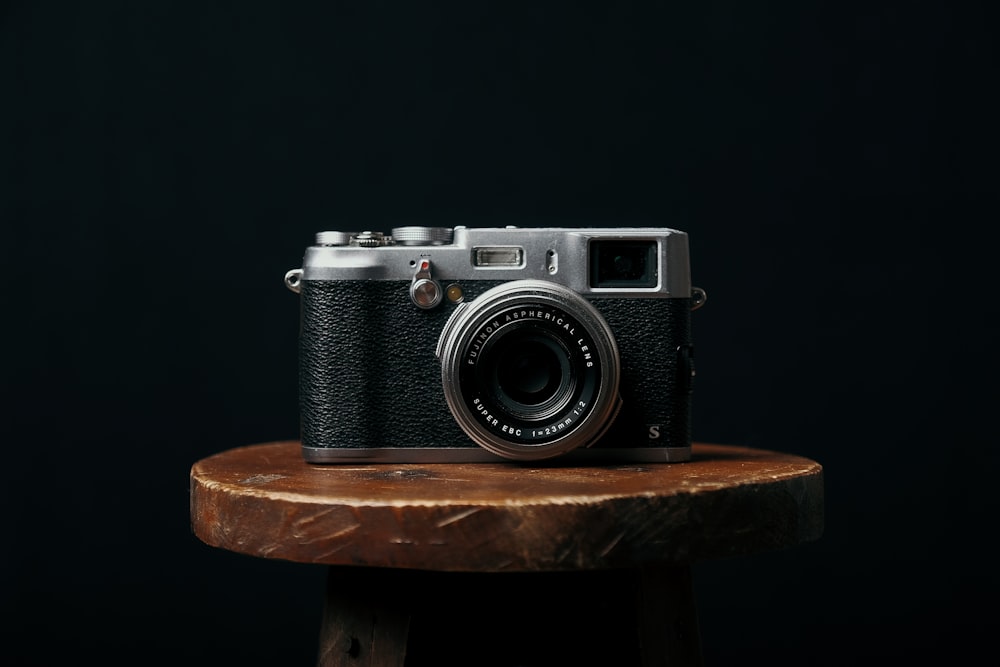 a camera sitting on top of a wooden table