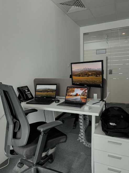 A modern office space with technology setups.