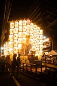 Colorful anime festival with lanterns and joyful characters in traditional attire.