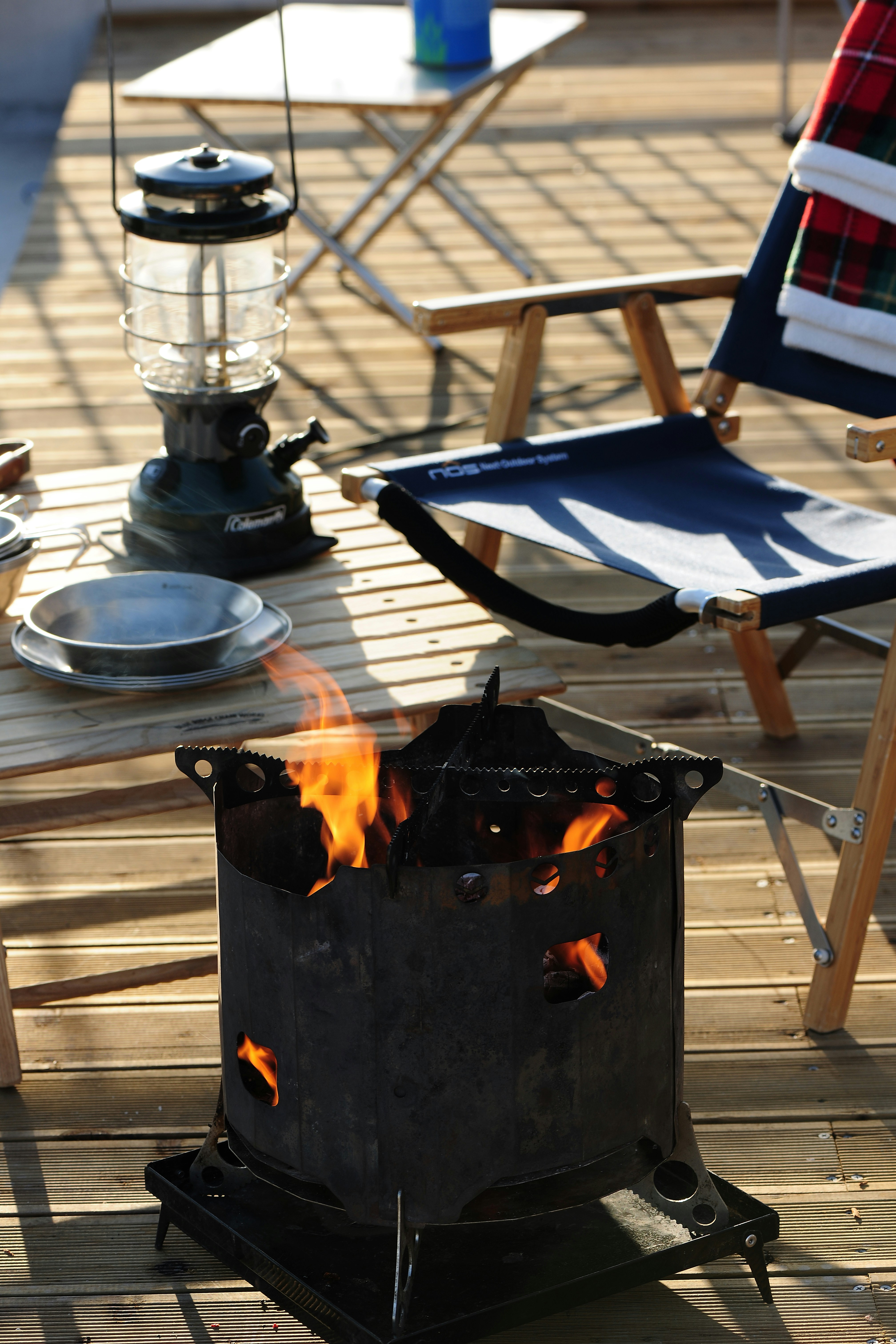 a fire pit sitting on top of a wooden deck