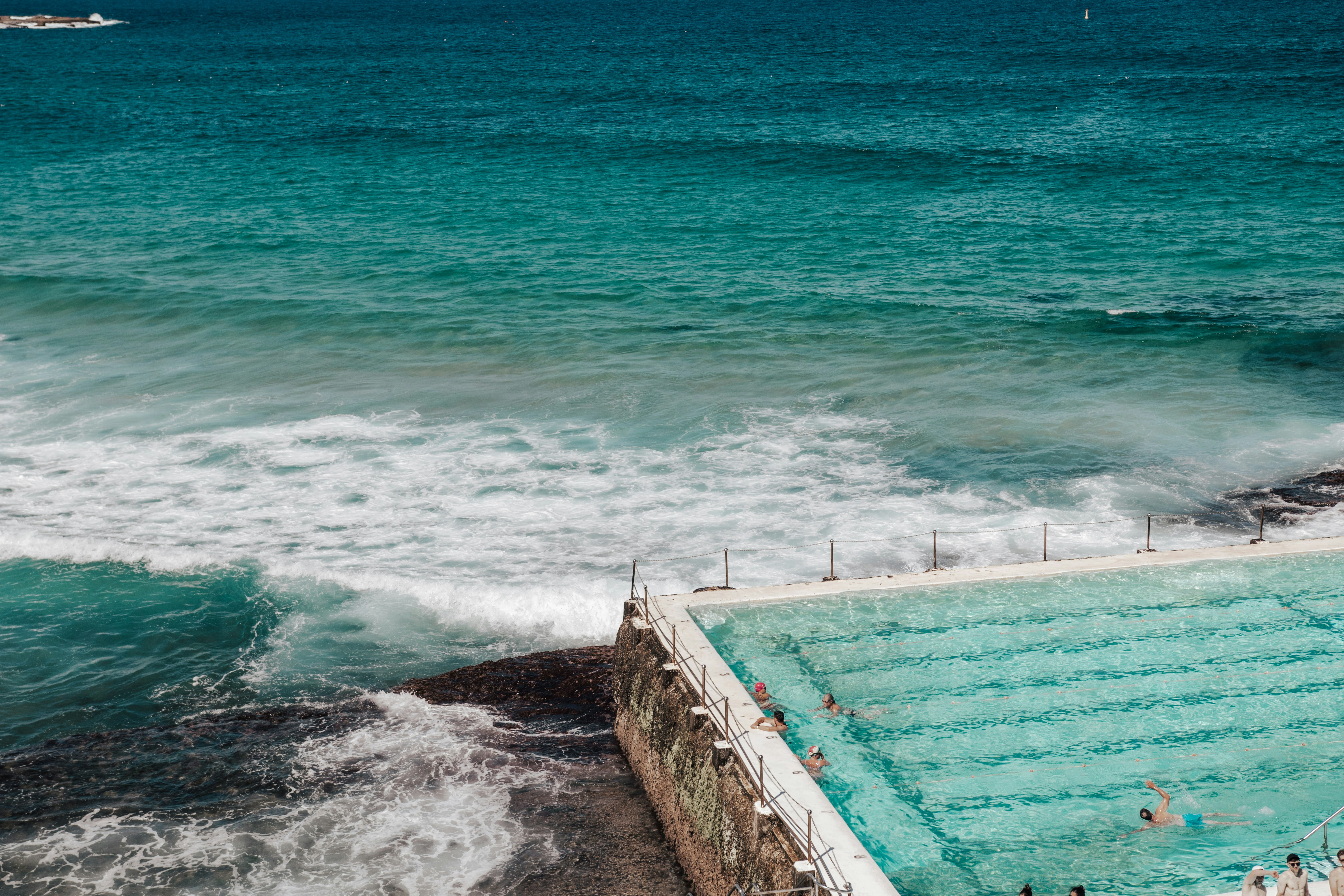 A large swimming pool in the middle of the ocean