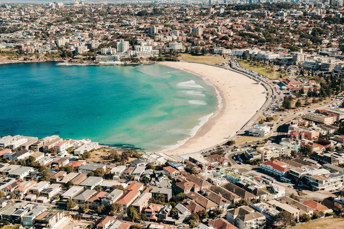 Aerial view of Bondi Beach in Sydney, with homes and apartments along the shore