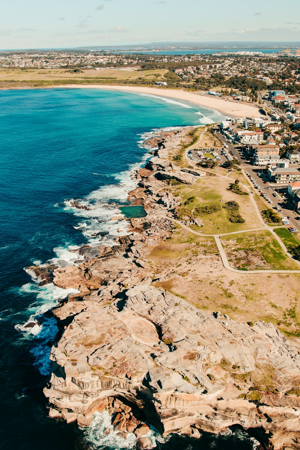 an aerial view of the coastline of a city