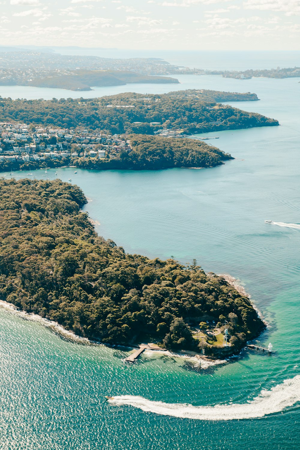 an aerial view of a small island in the middle of the ocean