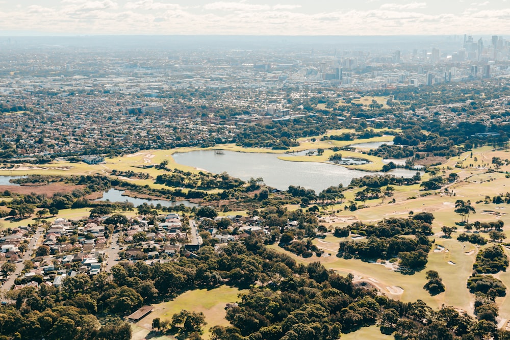 an aerial view of a city and a lake