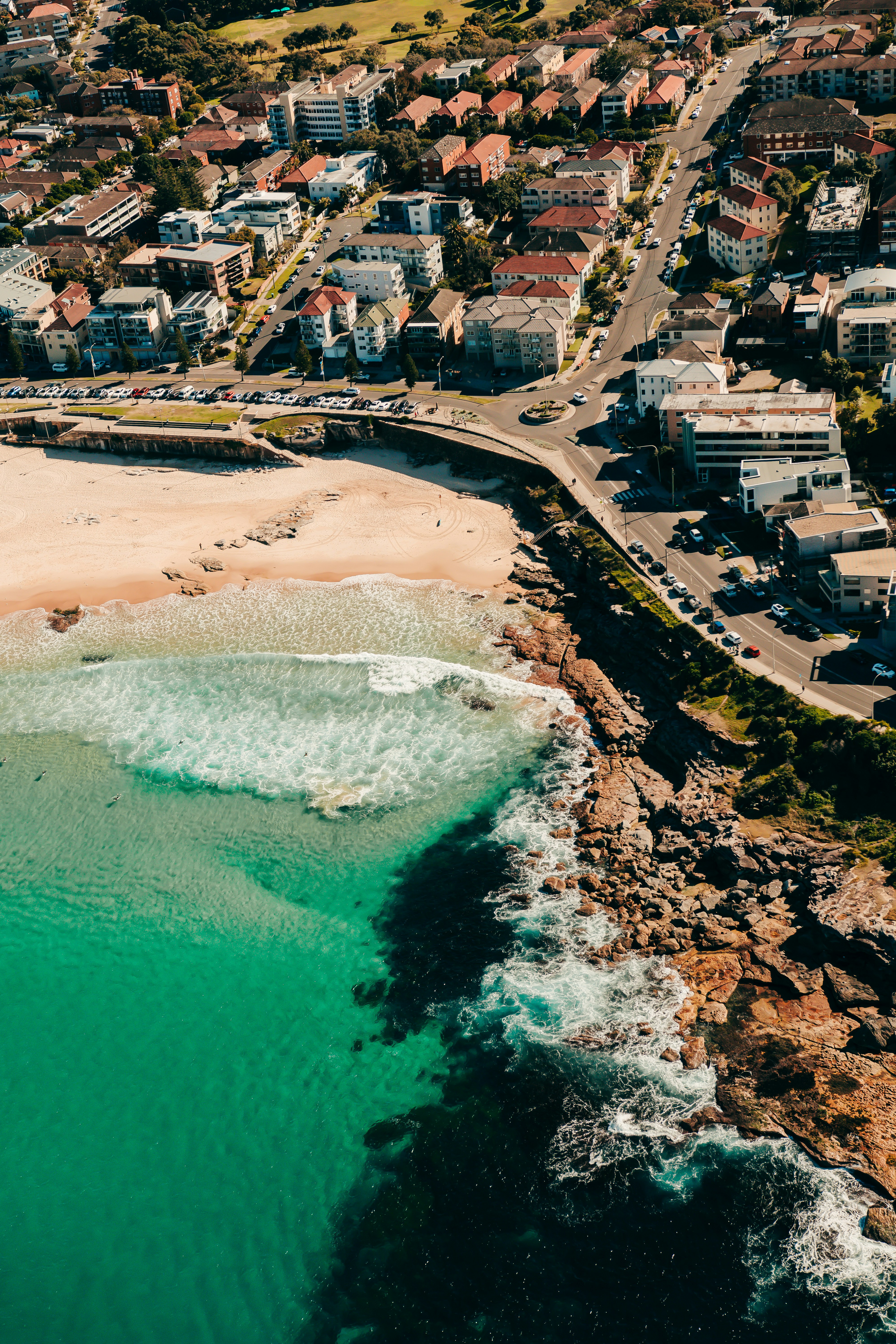 an aerial view of a beach and a city