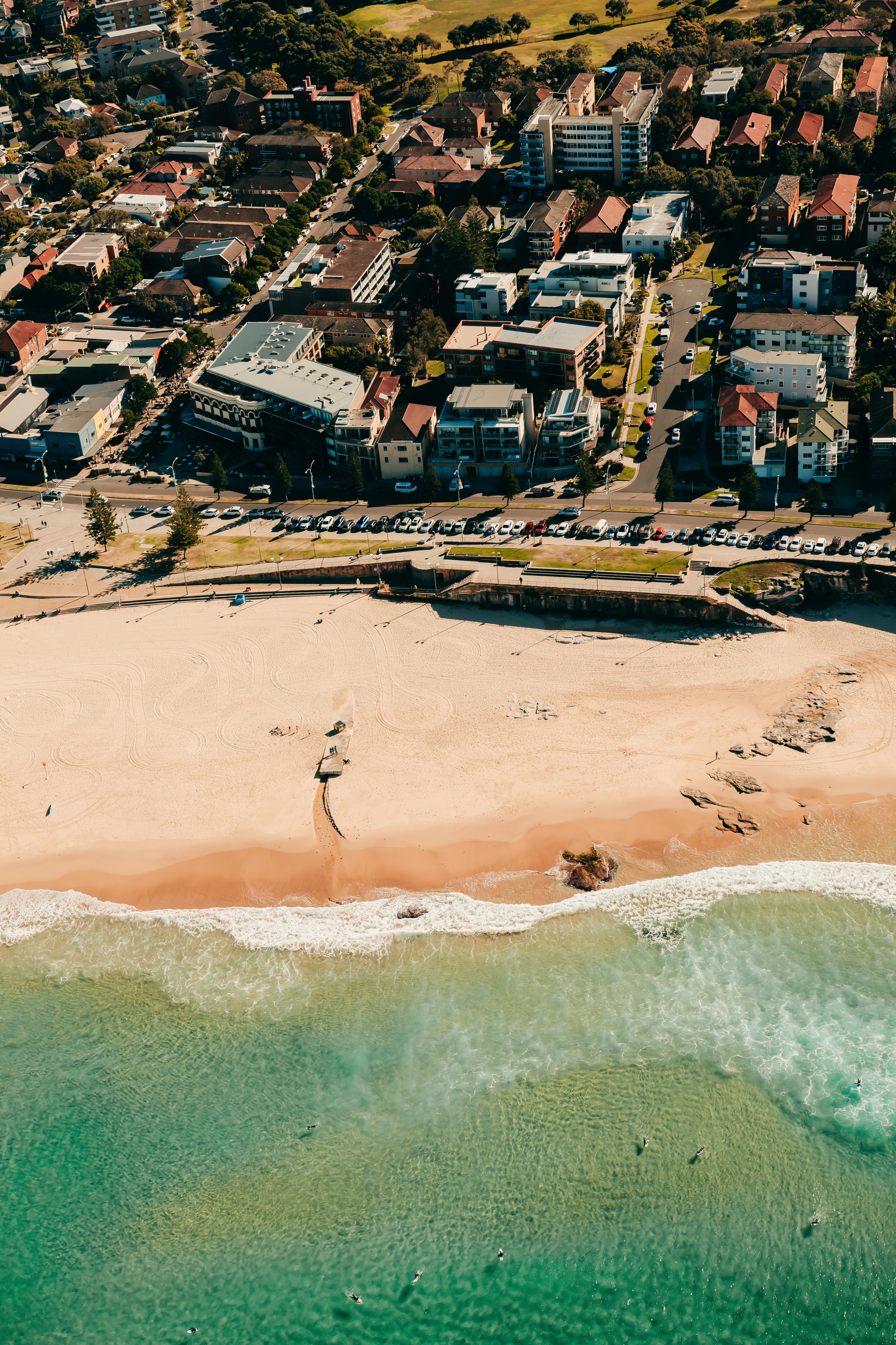 a bird's eye view of a beach and a city