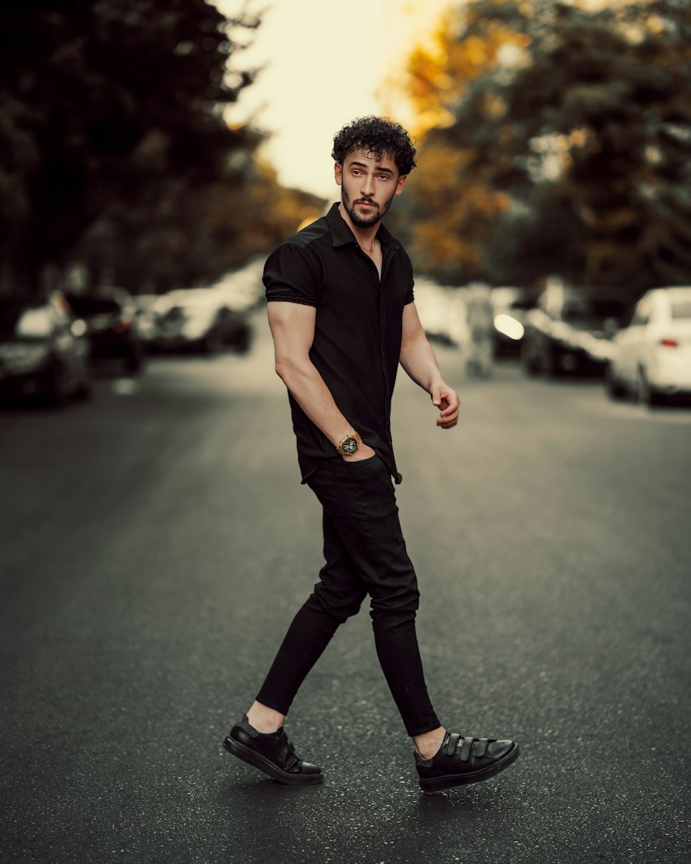 a man walking down the street in a black shirt