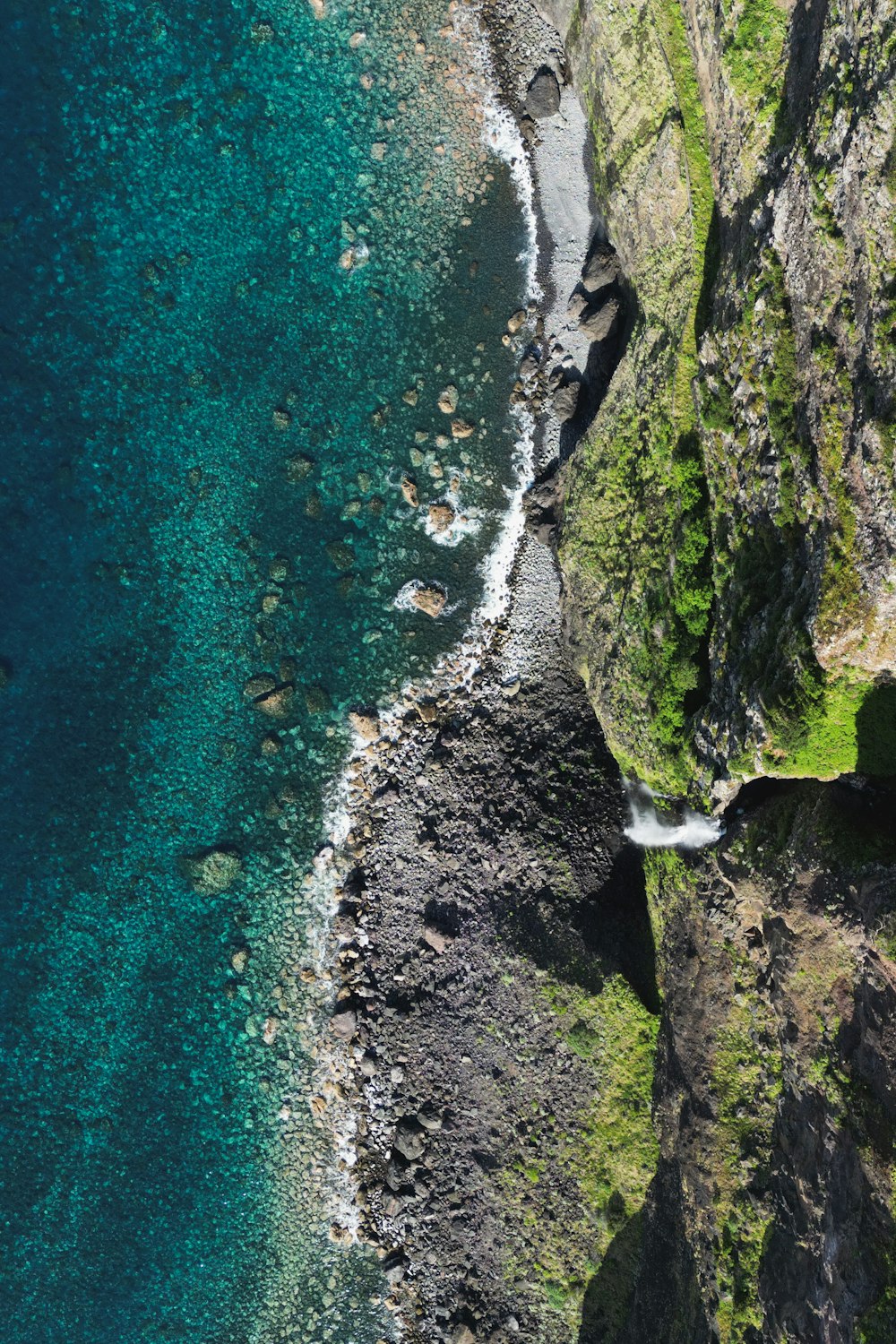 a bird's eye view of the ocean and cliffs