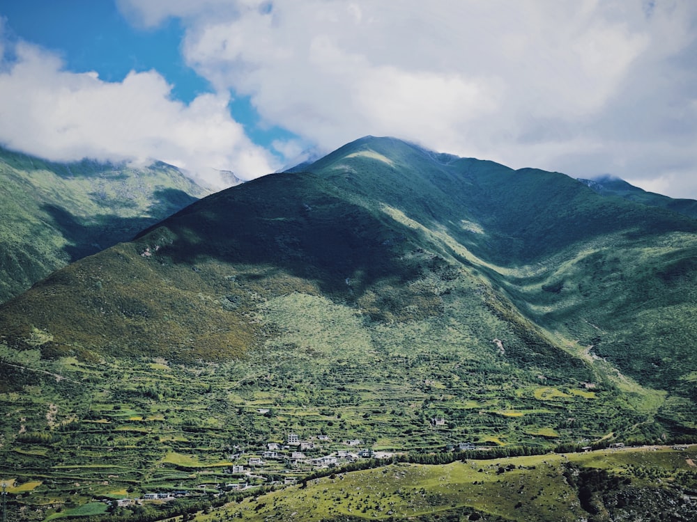 a view of a mountain range with a village below