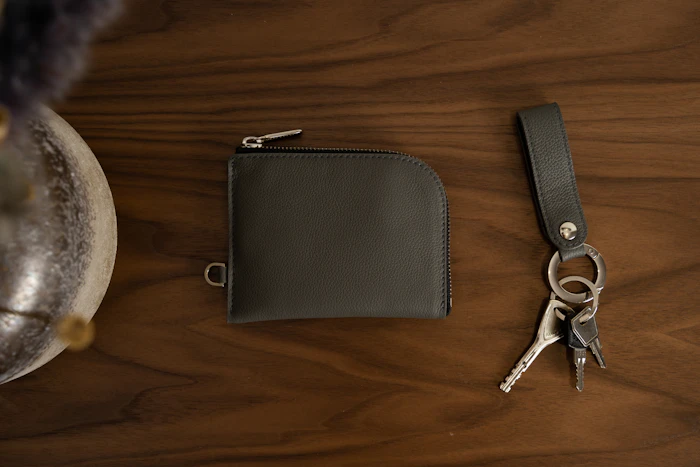Stitched leather piece with scissors