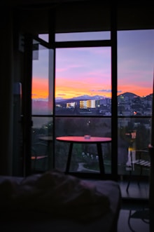 a view of a city from a bedroom window