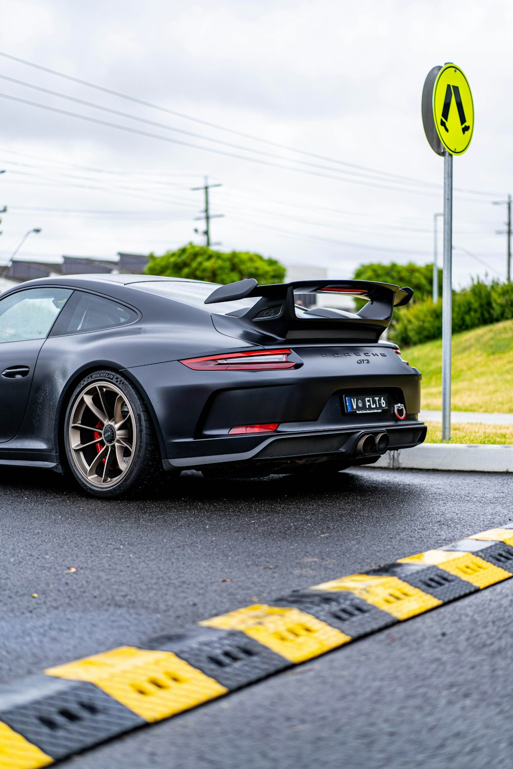 a black sports car parked on the side of the road