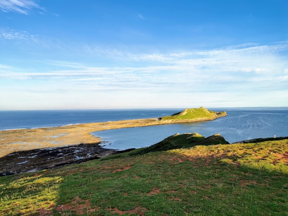 Scenic view of Salling peninsula showing coastal cliffs and lush greenery under a soft morning light.