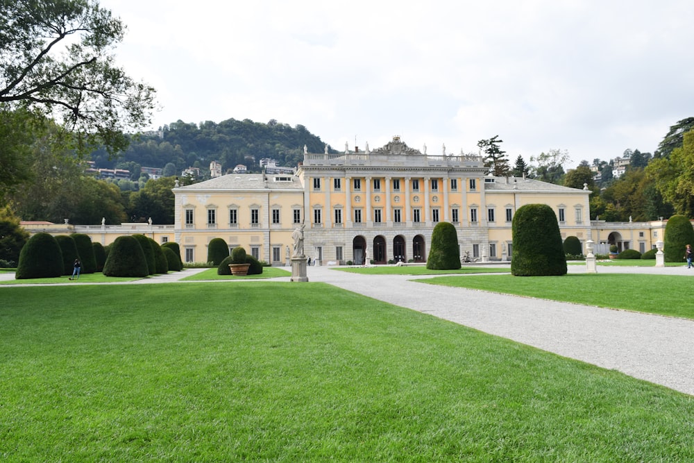 a large building with a long driveway in front of it