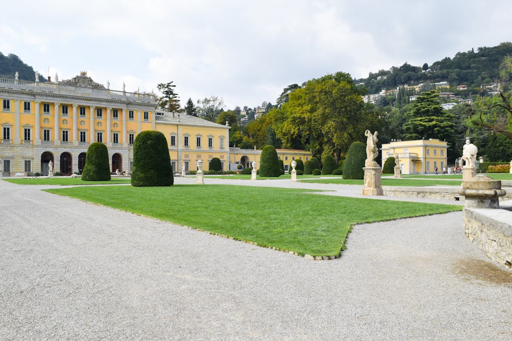 a large building with a lawn in front of it