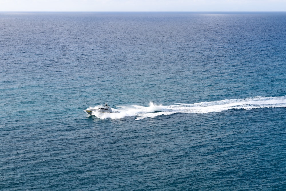 a boat is speeding across the water