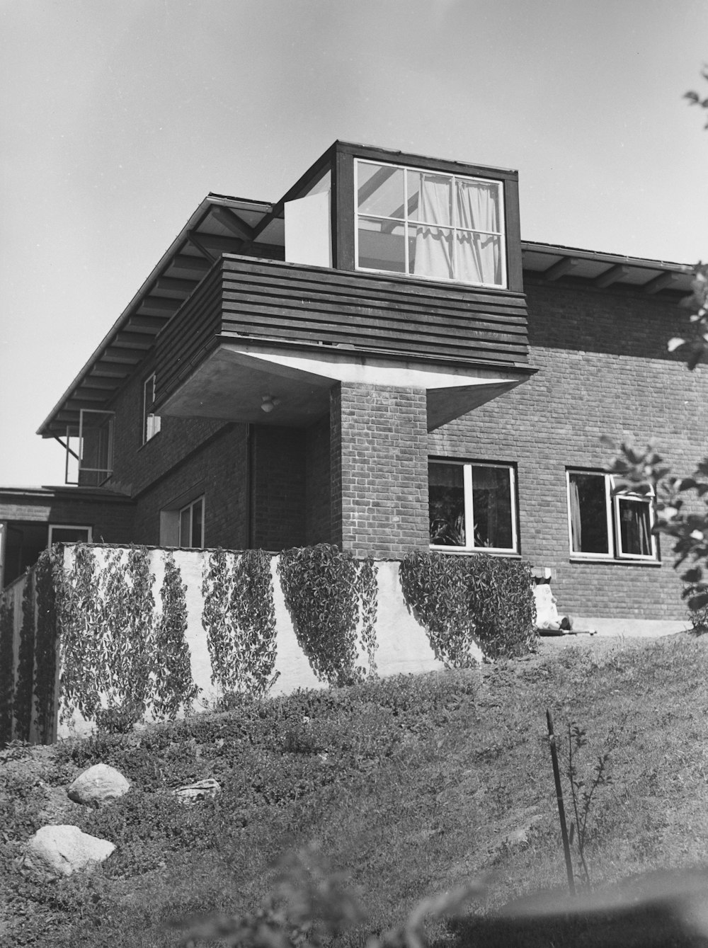 a black and white photo of a house