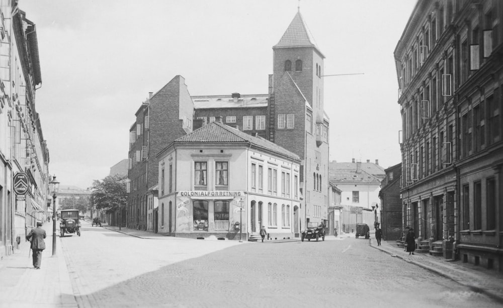 an old black and white photo of a city street