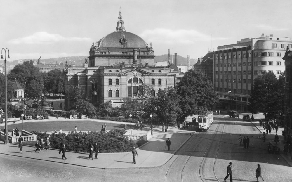 a black and white photo of a city square