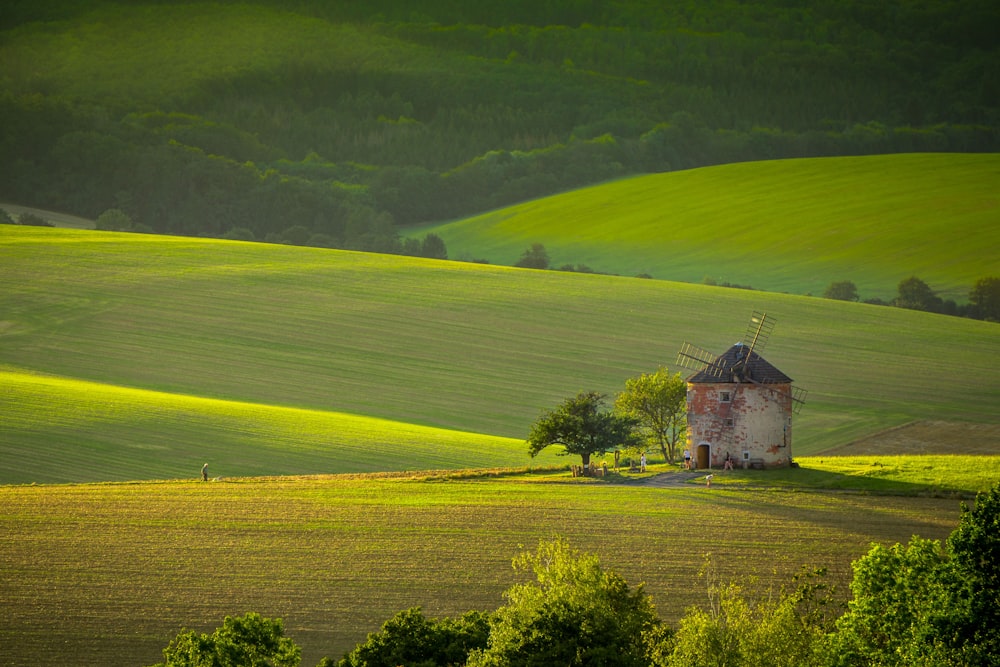 a house in the middle of a green field