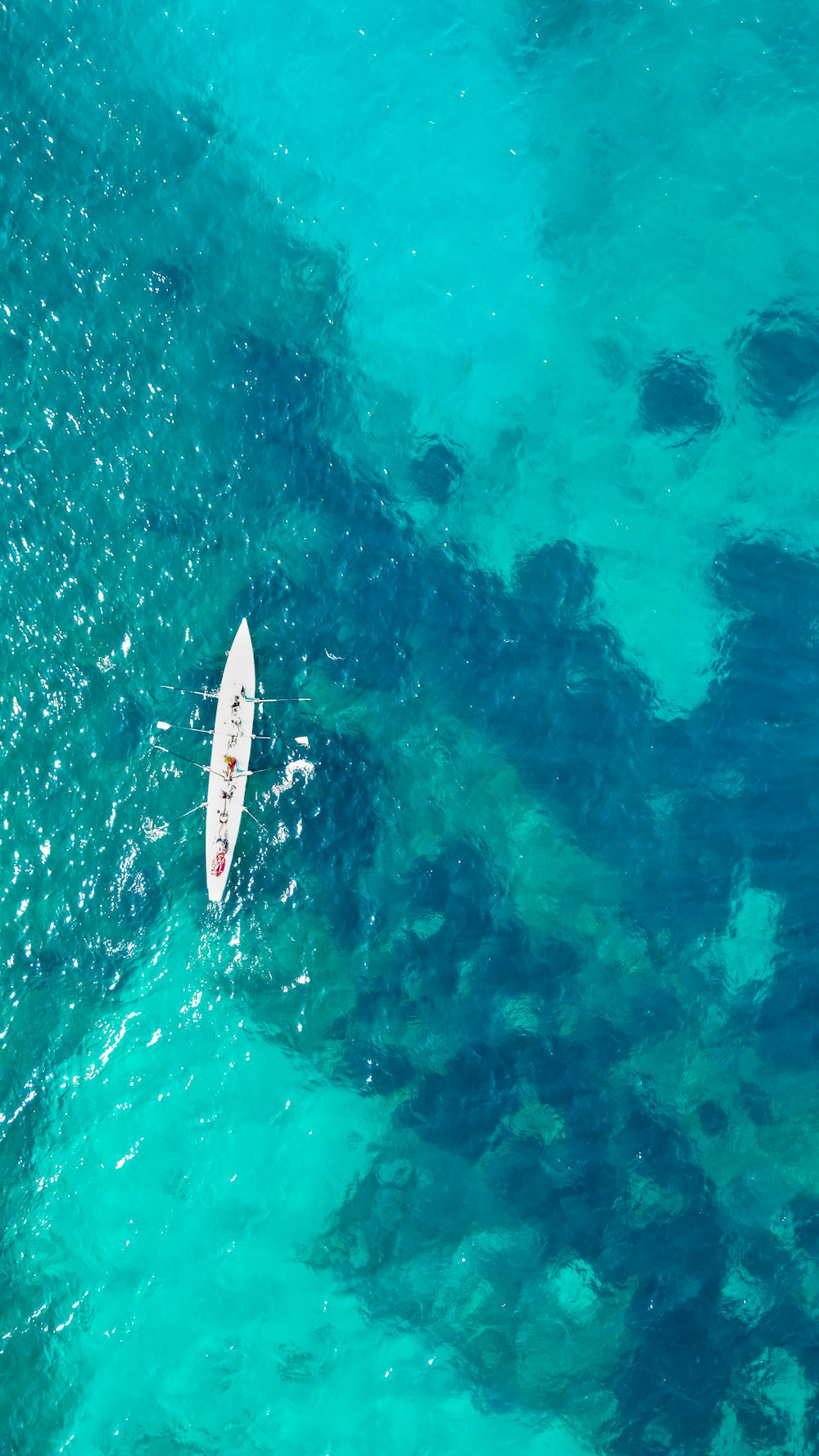 a person riding a surf board on a body of water