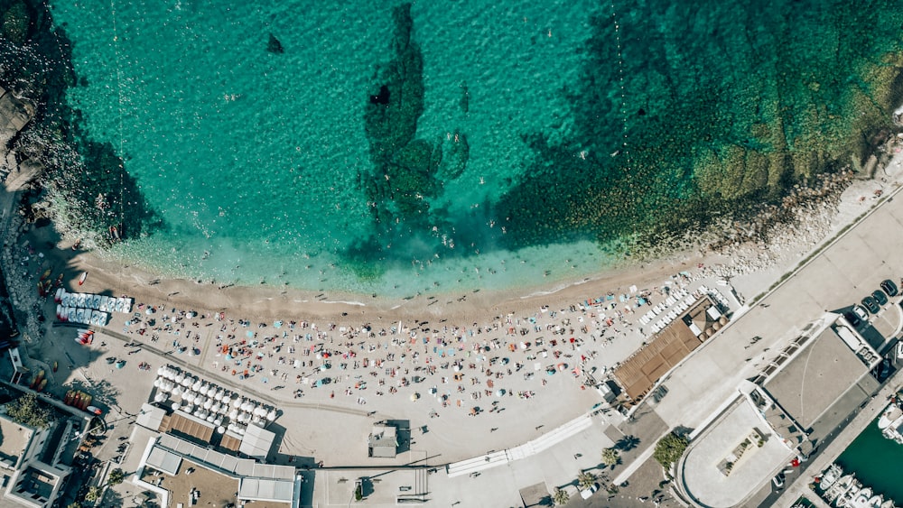 an aerial view of a beach with many people
