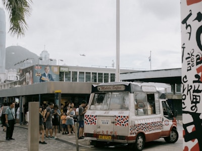 Volunteers handing out ice cream cones while sharing messages of hope beside the mobile van.