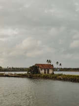 Cozy two-bedroom house nestled among lush reeds and waterways of the Ebro Delta at sunset