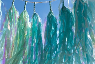 Close-up of twisted spiral streamers in various shades of blue and pink.