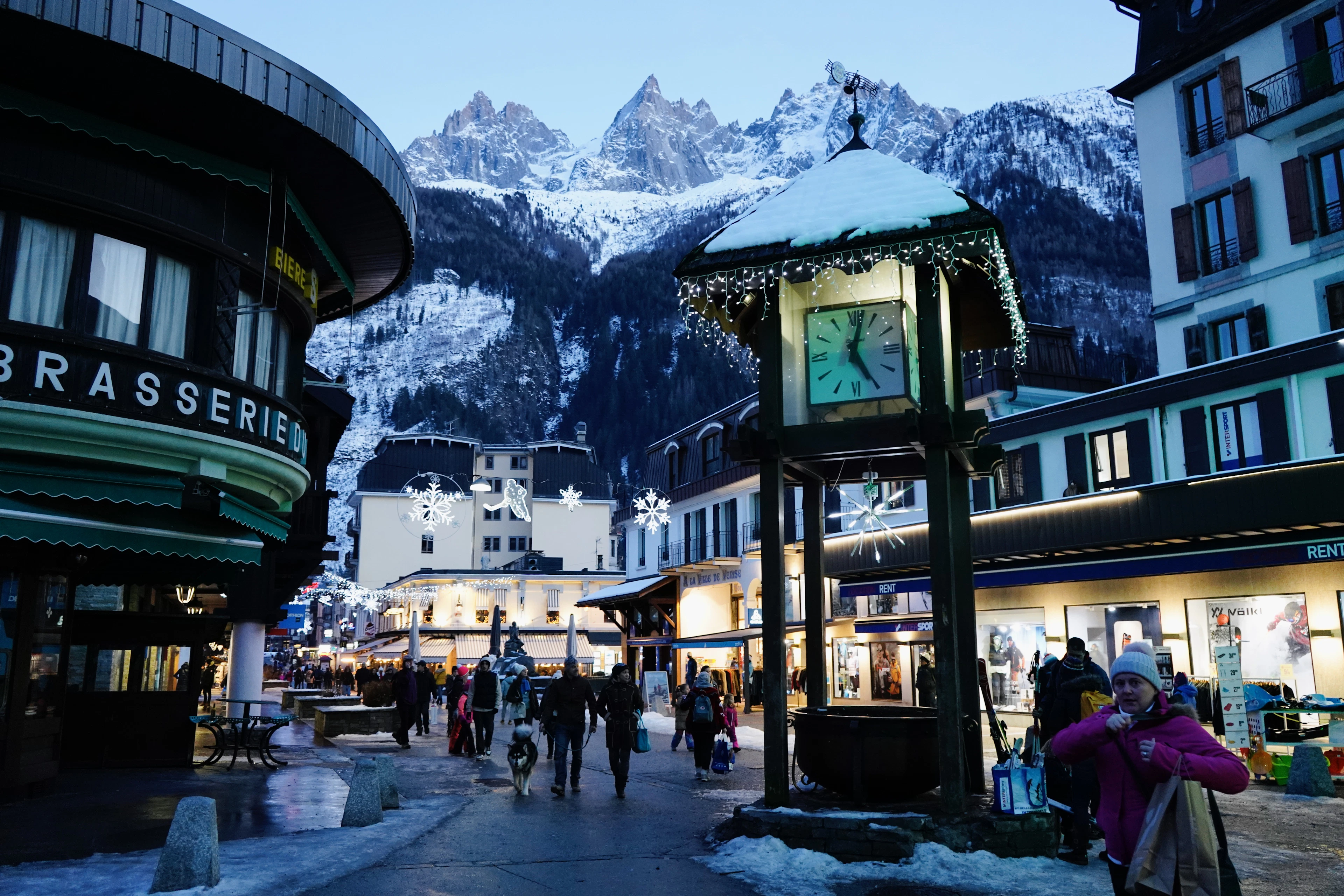 Chamonix town centre and its clock tower, with the mountains behind