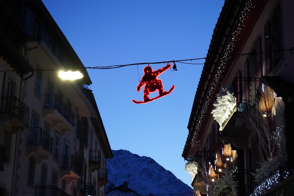 a christmas decoration of a teddy bear hanging from a wire