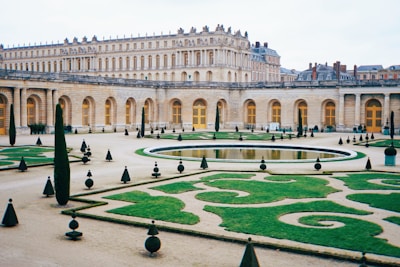 a large building with a fountain in the middle of it