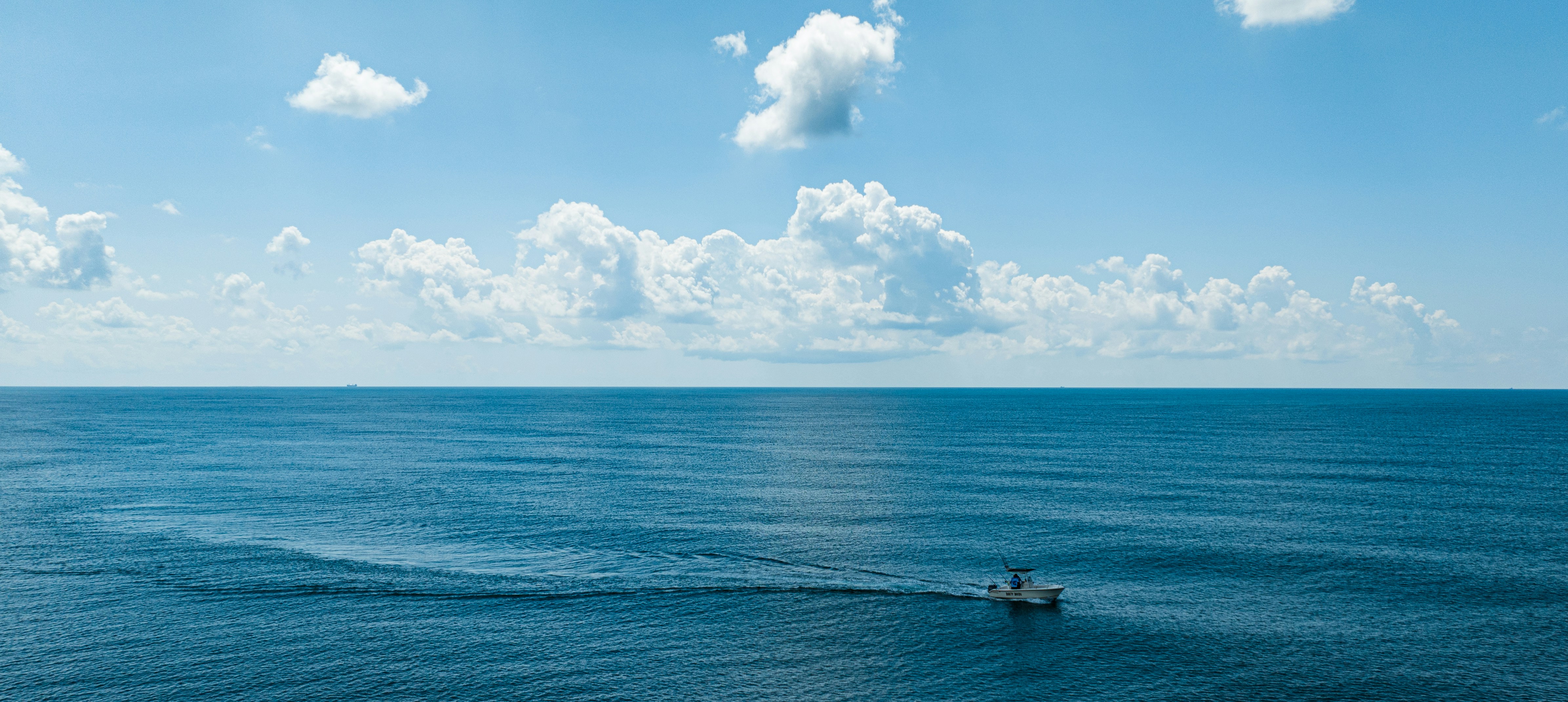 a boat in the middle of a large body of water
