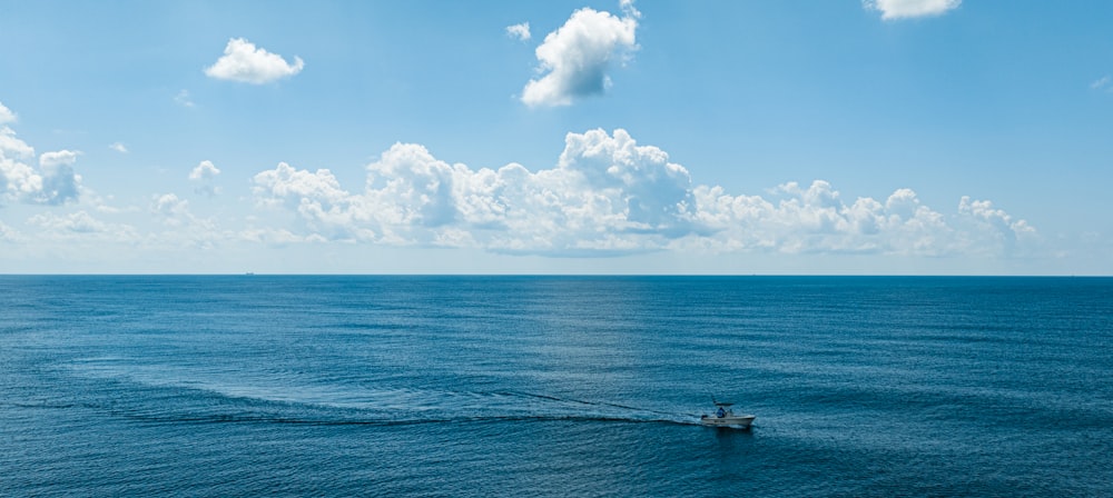 a boat in the middle of a large body of water