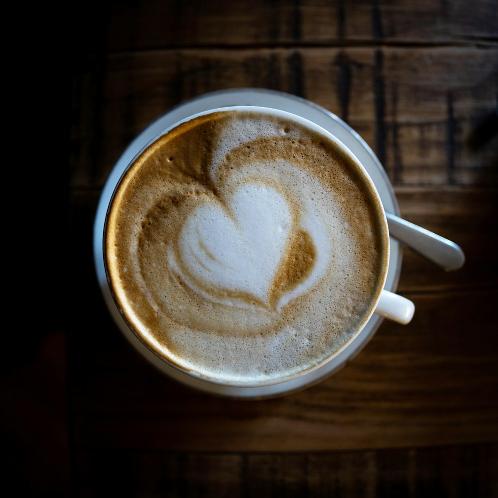a cup of coffee with a heart drawn on it