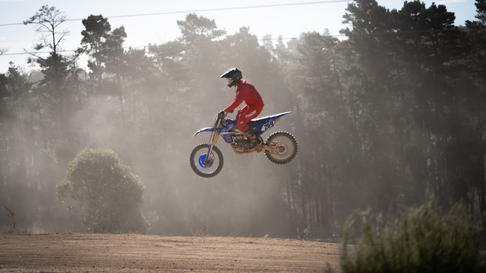 a person on a dirt bike in the air