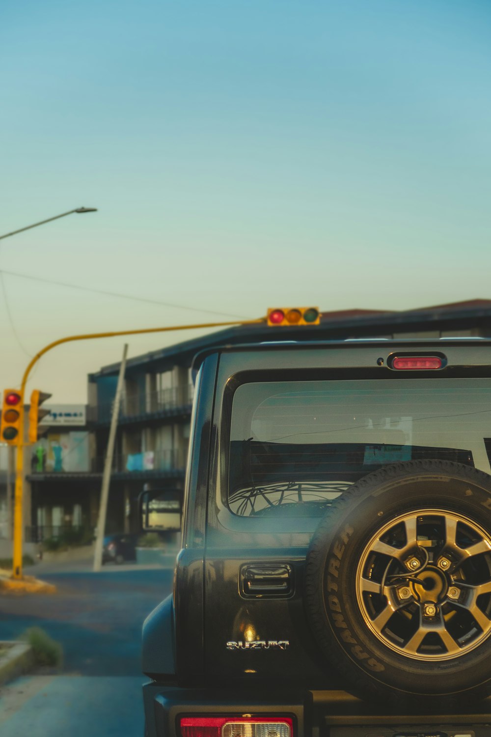 a black jeep parked on the side of the road