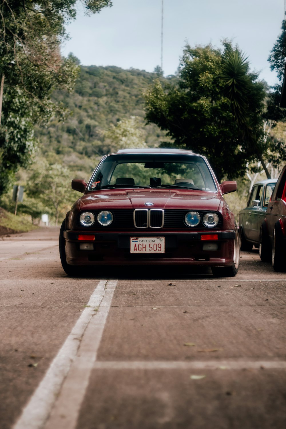 a red car parked on the side of the road